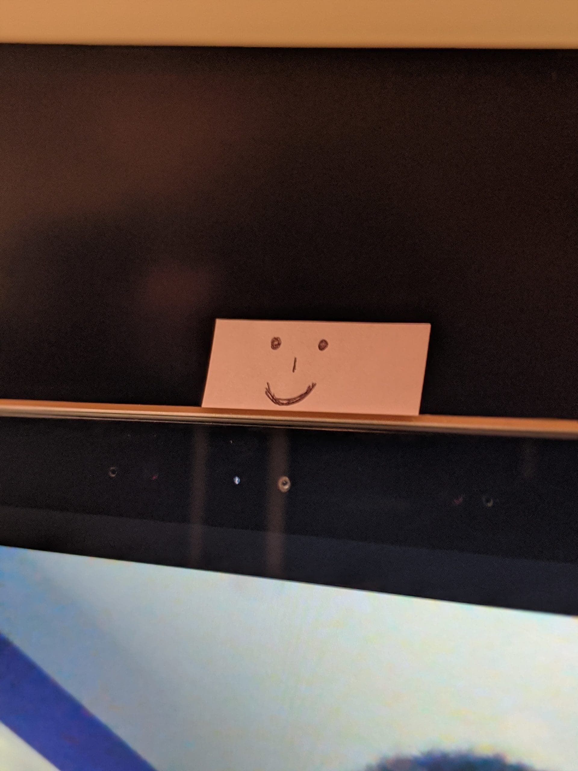 Smiley Face Post It Above Webcam