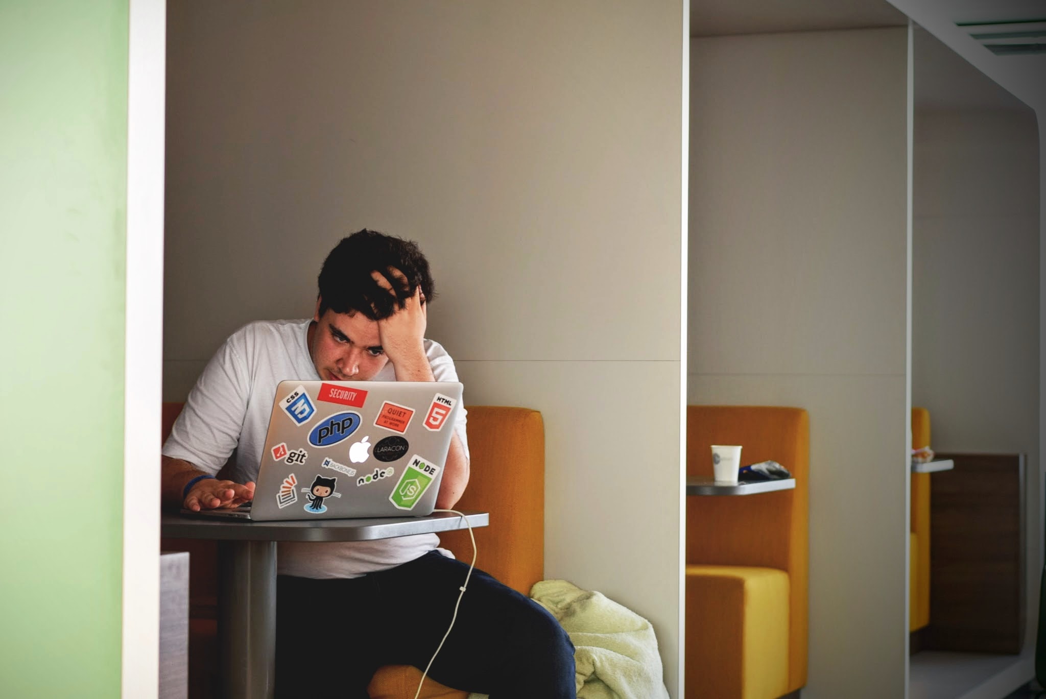 Man is frustrated and stressed out while looking at his laptop