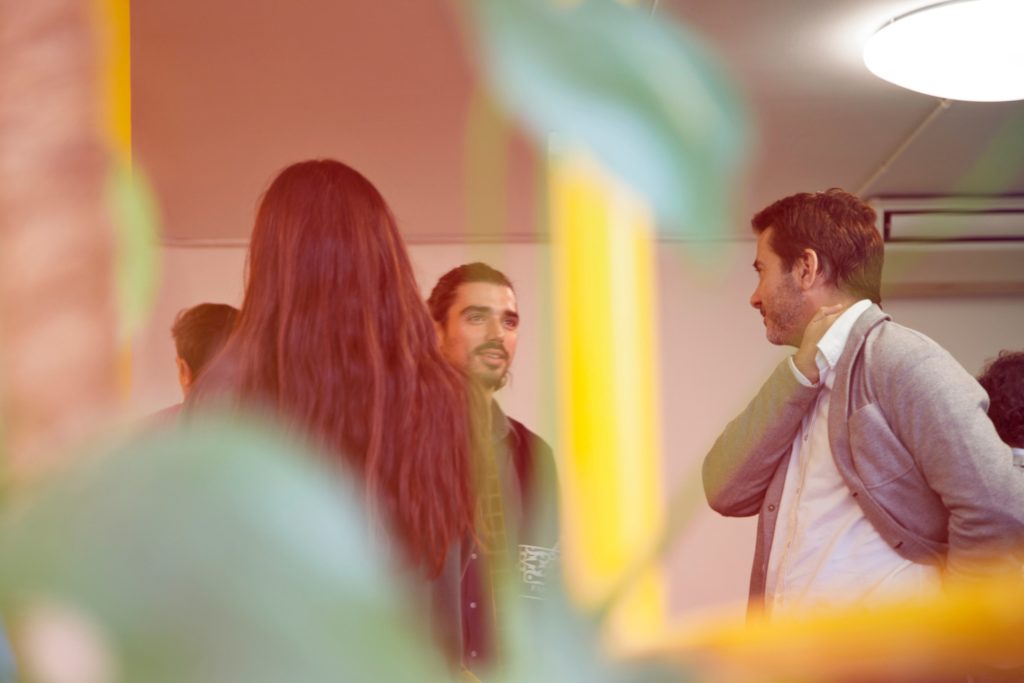 A business man delivering an elevator pitch while walking next to someone