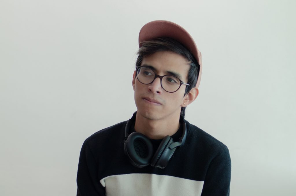 young man with a cap and headphones on