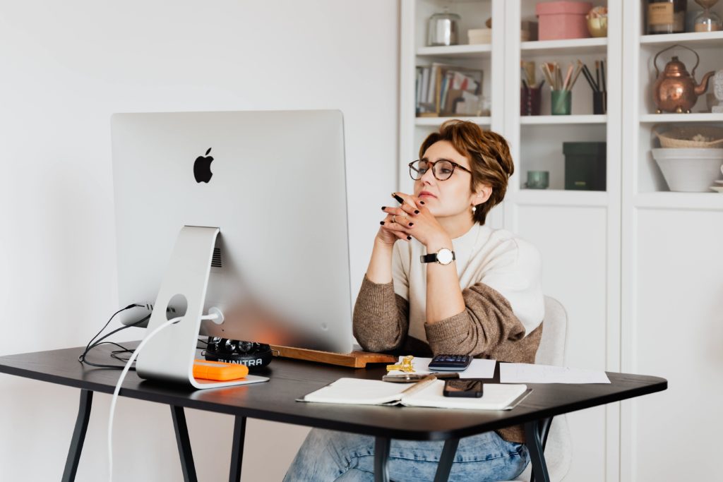 woman writing a creative resume