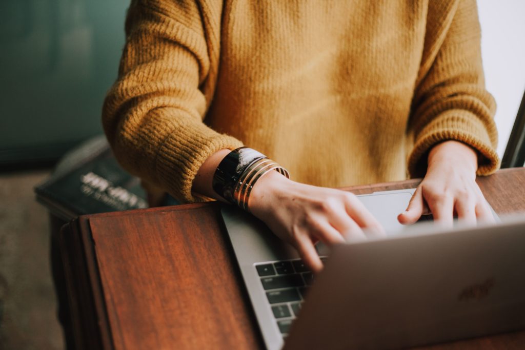 woman writing down her resume references