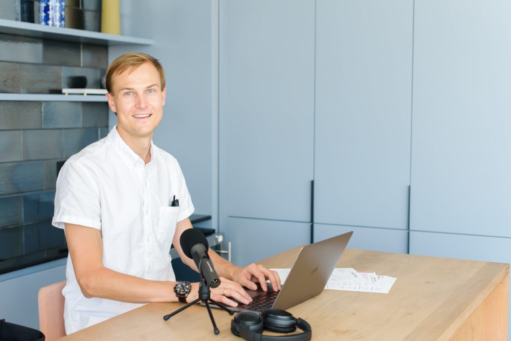 Man Staying Motivated At Work At His Desk